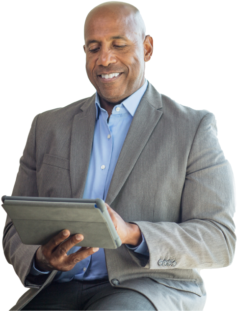 Man working on a computer, managing health and wellness services
