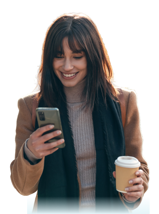 woman smiling at her phone