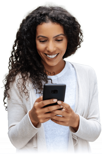 Happy woman using her smartphone to communicate online with a smile.