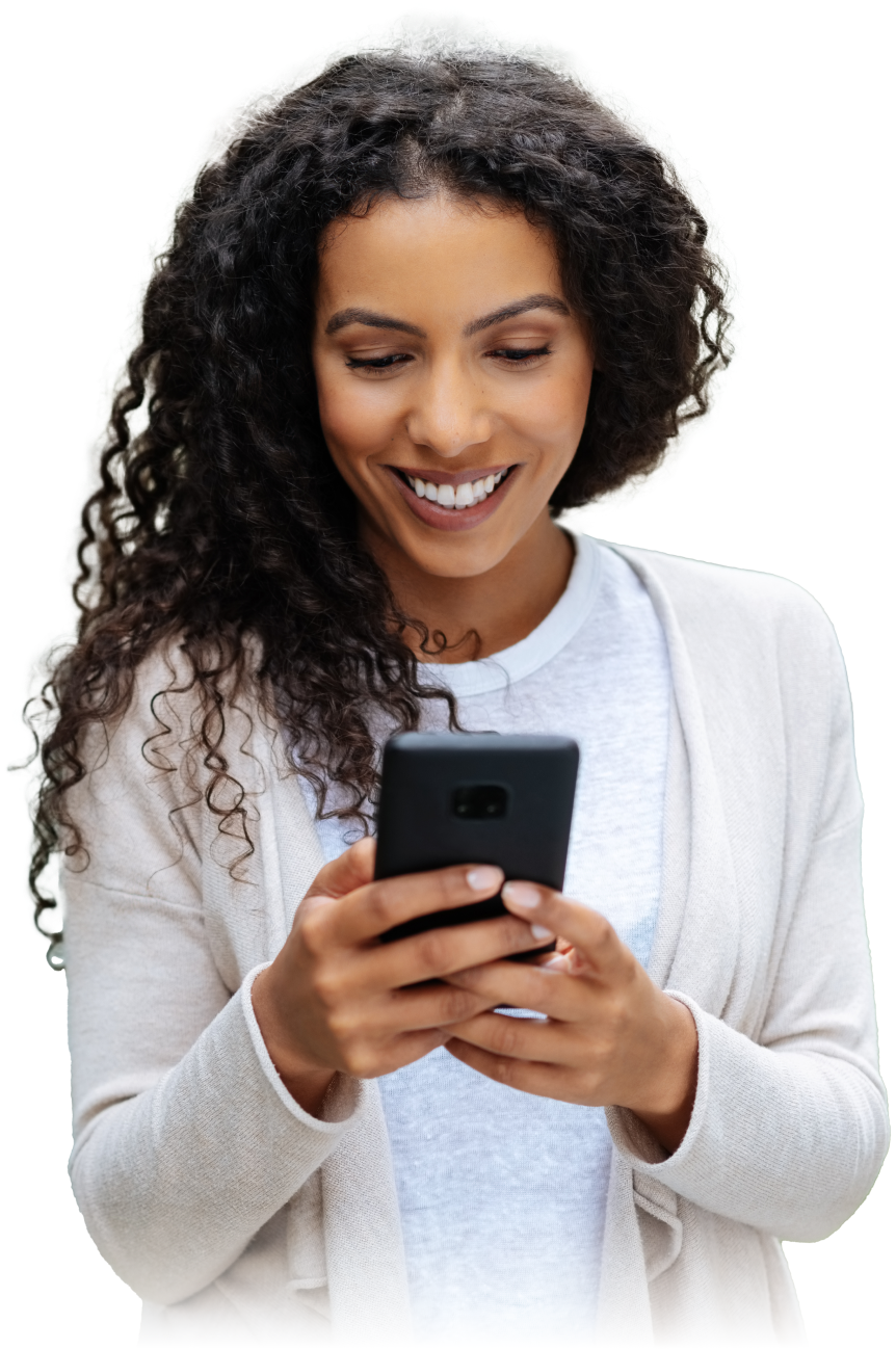 Happy woman using her smartphone to communicate online with a smile.