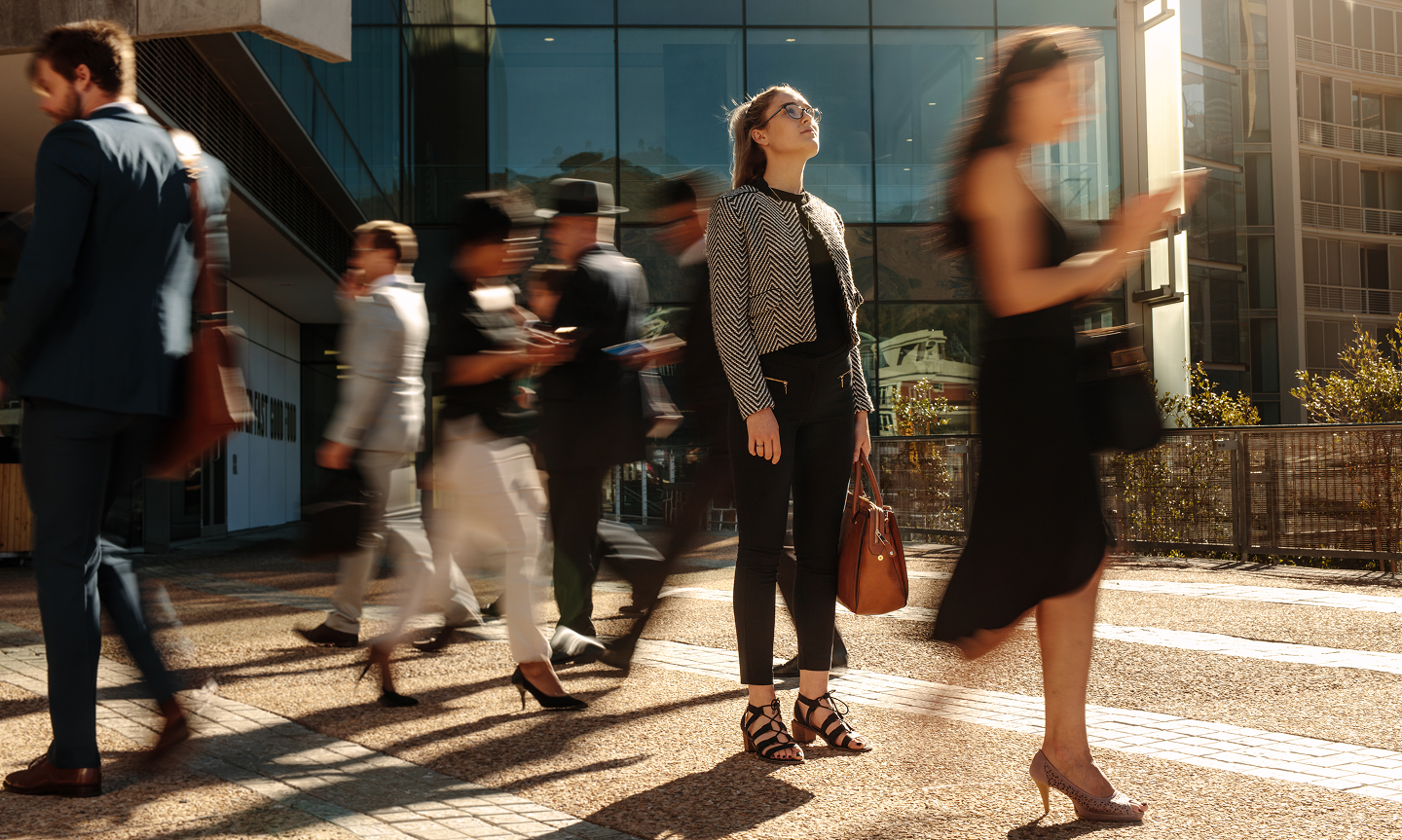 A person taking a break in the middle of a group walking
